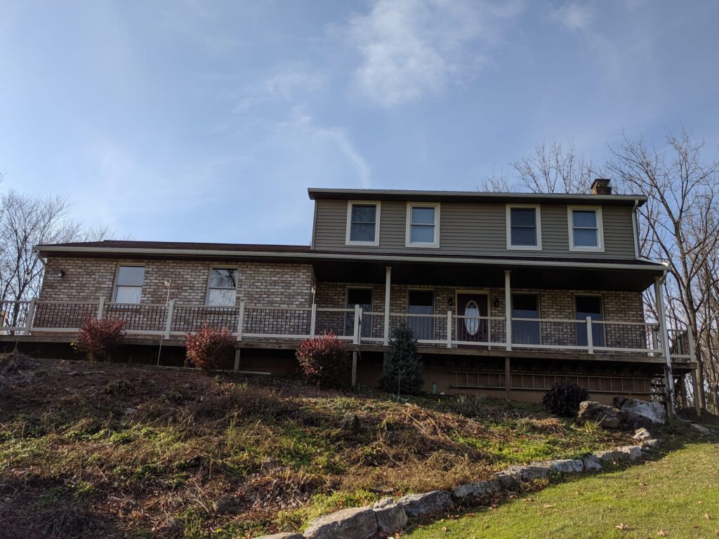 Elevated Front Porch With Brick Exterior